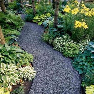 100 Garden Pathway Ideas and Inspiration - Golly Gee Gardening #gardenpaths #gardenpathways #gardeninspiration #gardenideas